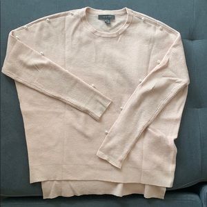 Pale pink sweater with pearl detailing